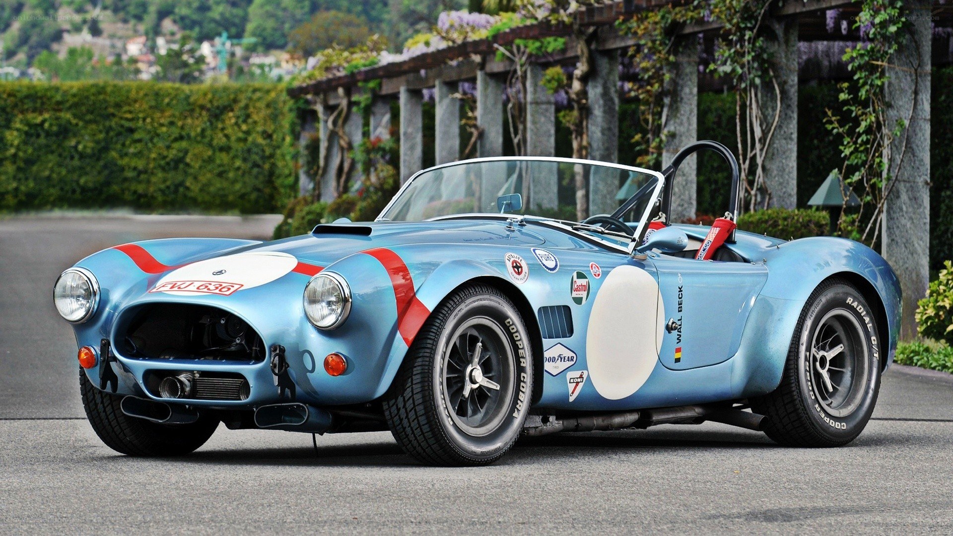 blue racing car on road