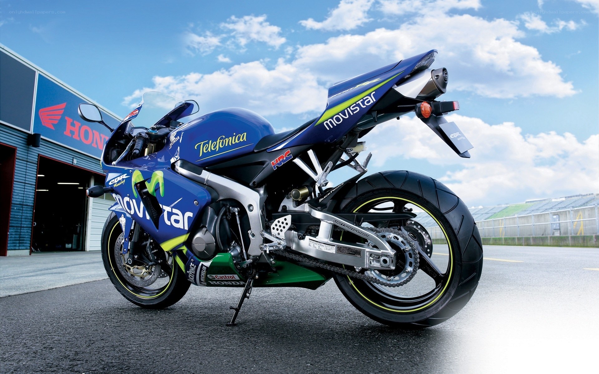 blue racing motorcycle on track