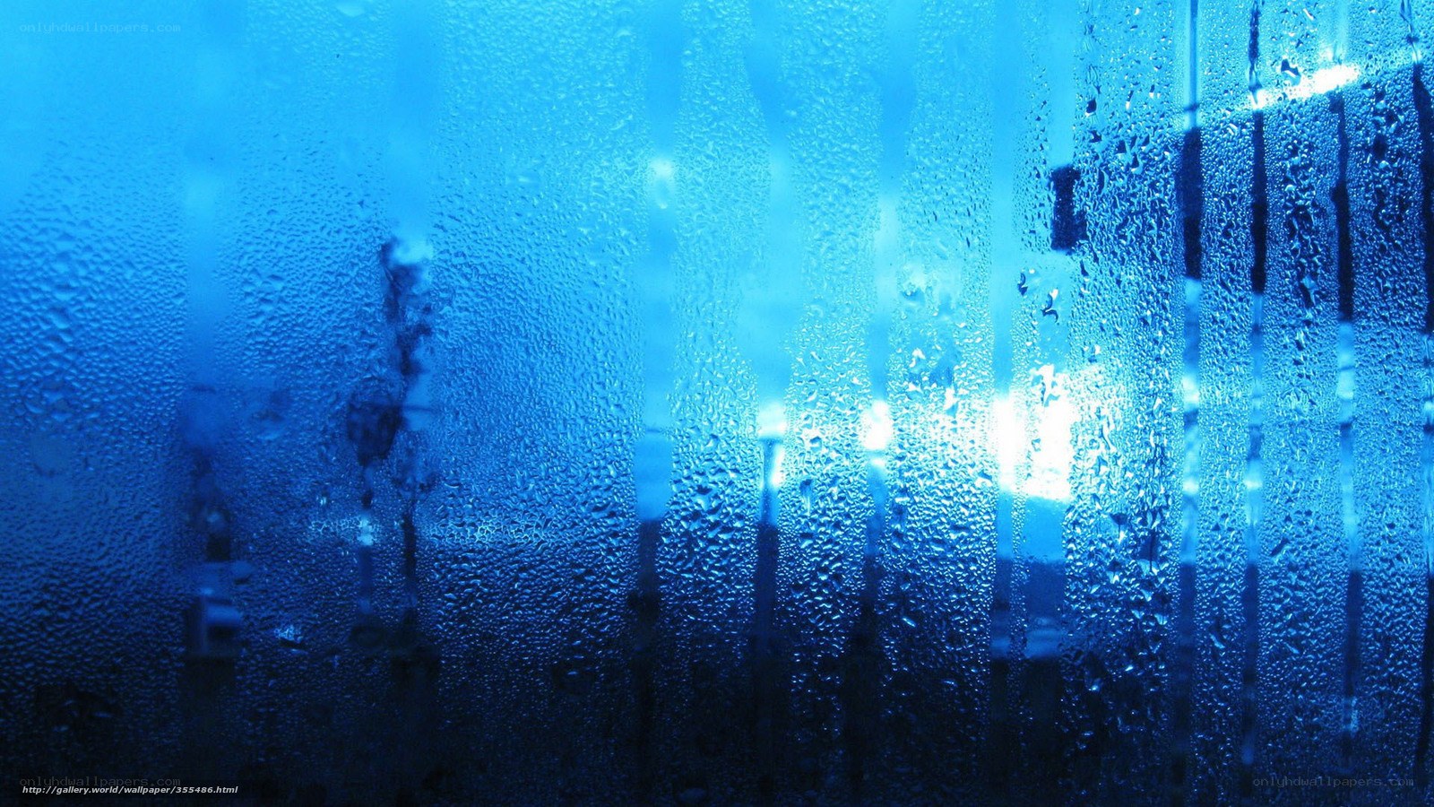 Blue raindrops on glass