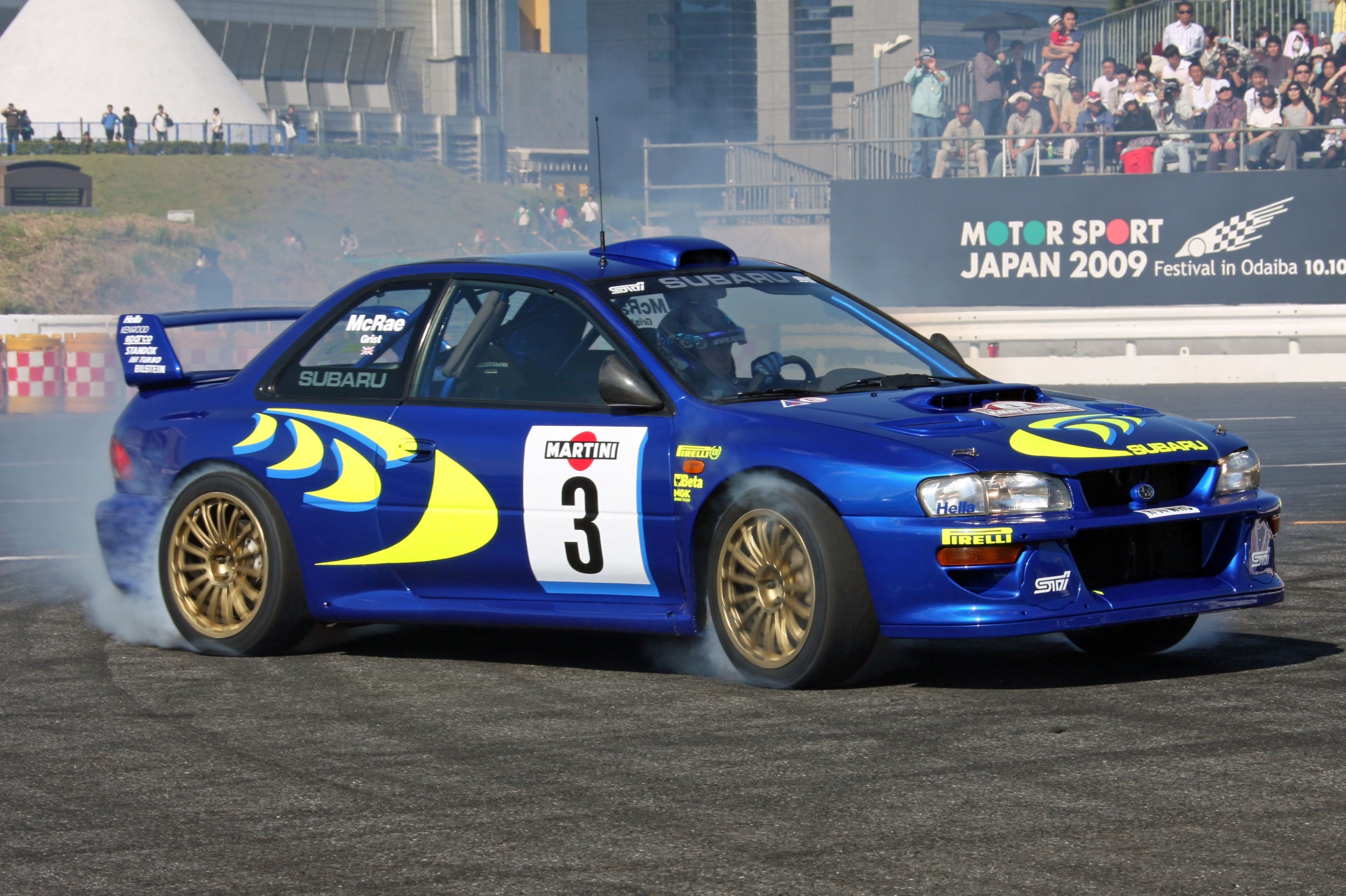 Blue rally car drifting