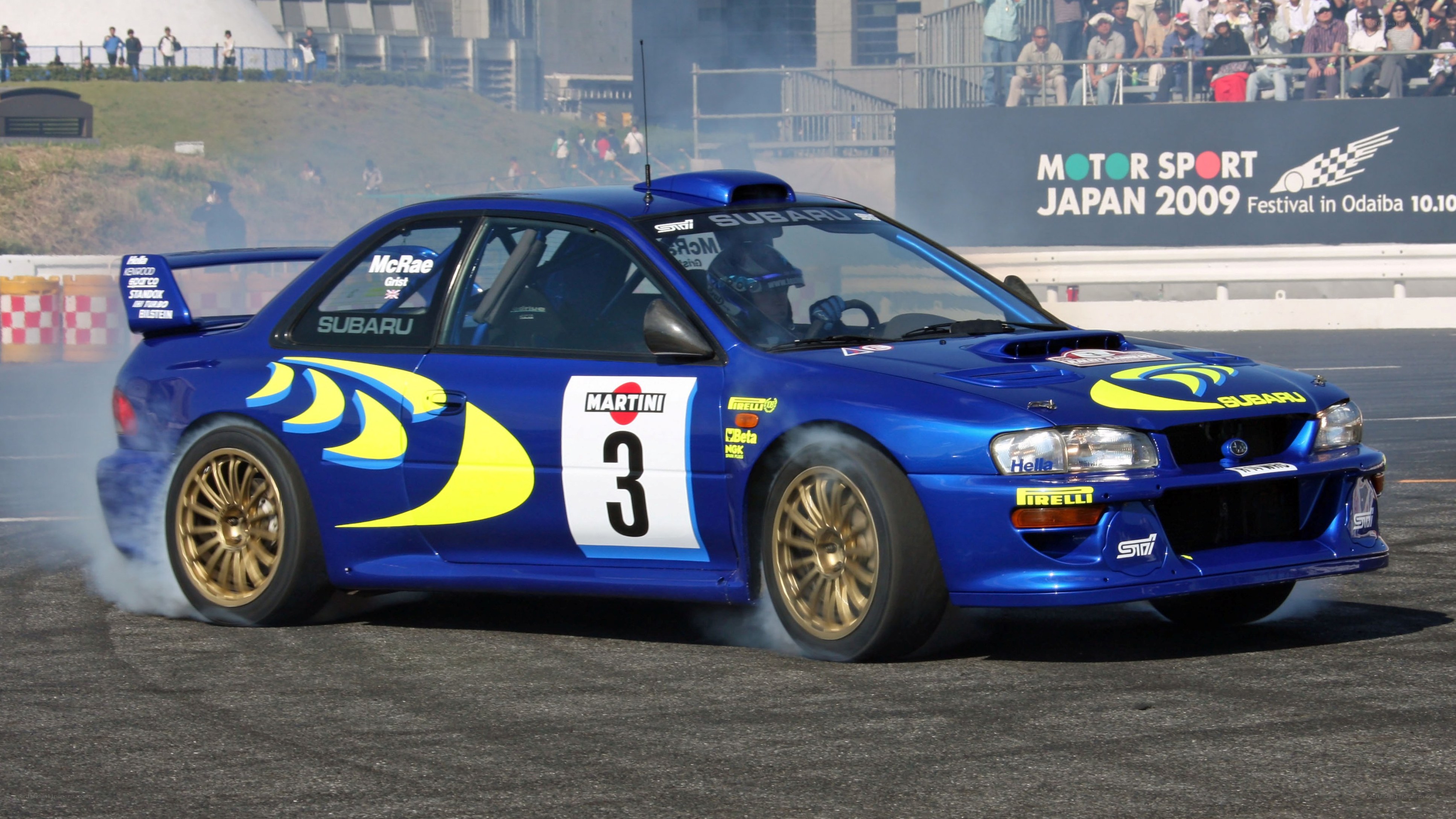 Blue rally car drifting