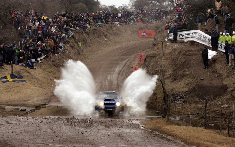 Blue Rally Car — Dynamic, Afternoon, Photograph, Crowd, Mud, Splash