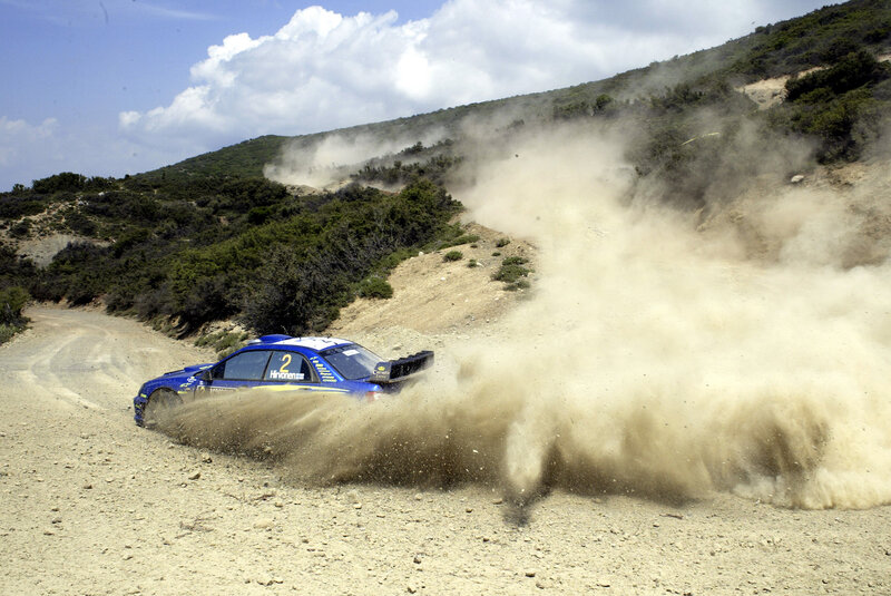 Blue Rally Car — Dynamic, Afternoon, Photograph, Dirt Road, Dust Cloud, Hill
