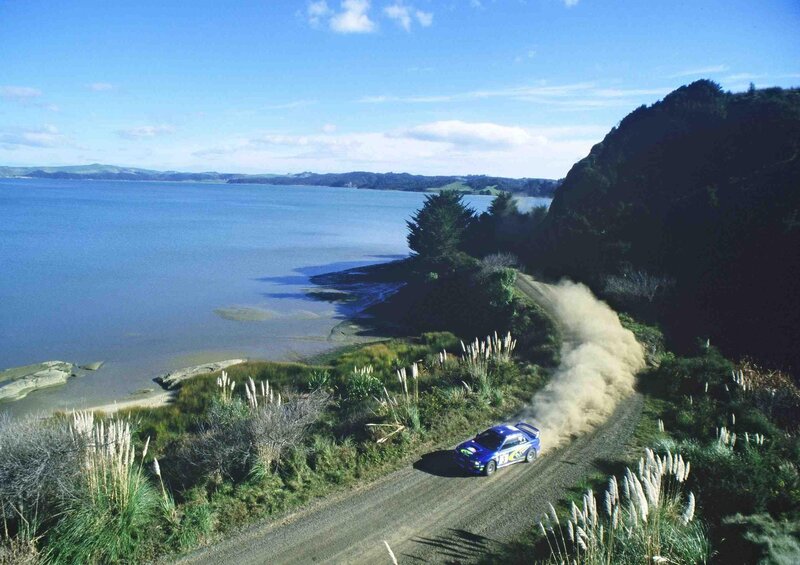 Blue Rally Car — Dynamic, Afternoon, Photograph, Dirt Road, Lake