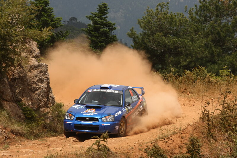 Blue Rally Car — Dynamic, Afternoon, Photograph, Dirt Road, Trees, Dust
