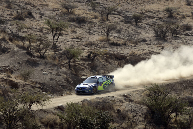 Blue Rally Car — Dynamic, Afternoon, Photograph, Dust, Desert