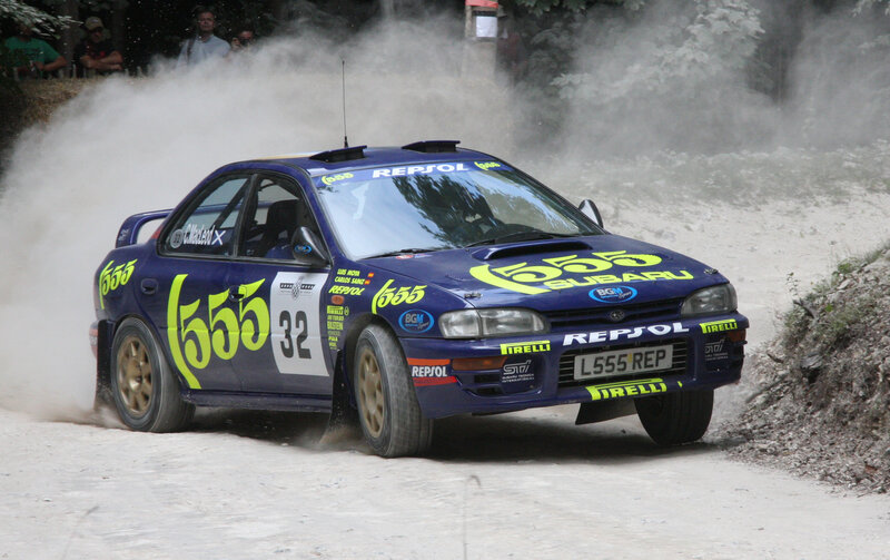 Blue Rally Car — Dynamic, Afternoon, Photograph, Dust, Spectators, Trees