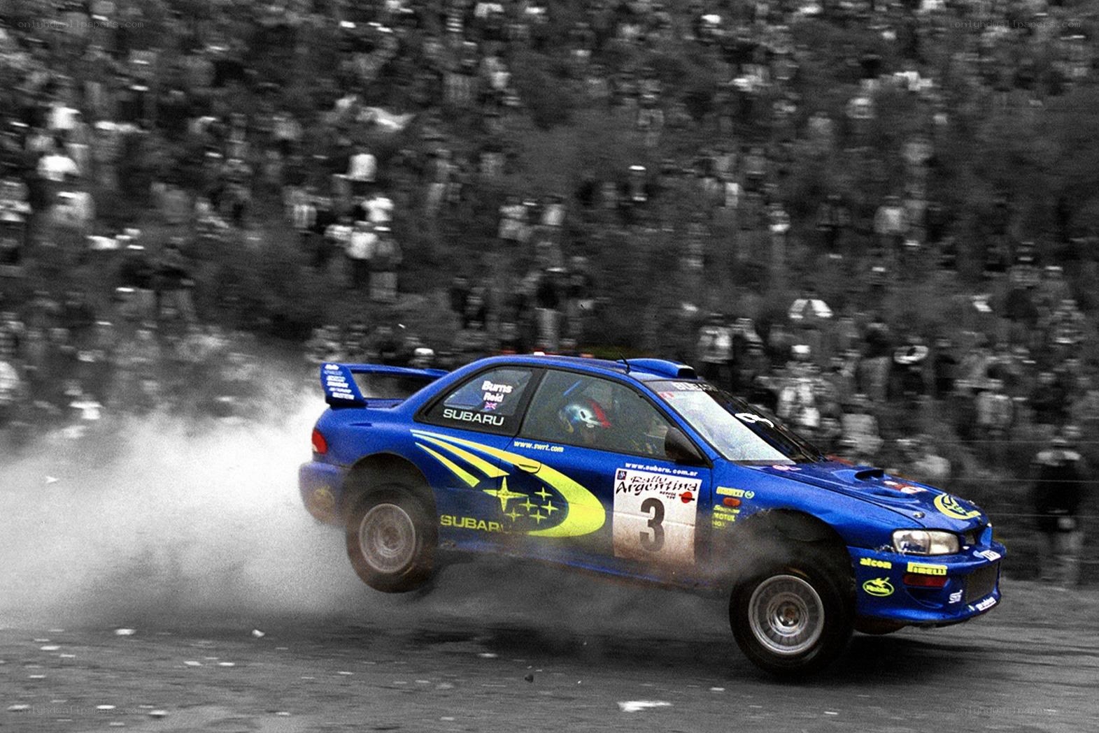 Blue rally car in action
