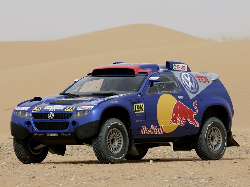 blue rally car in desert