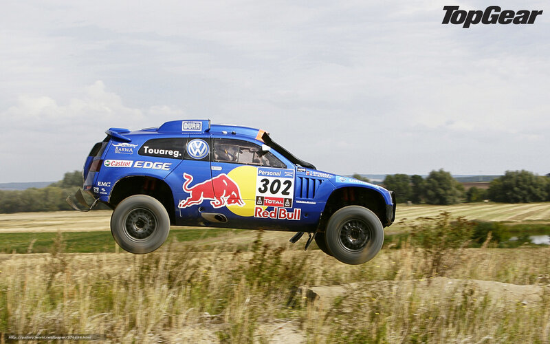 Blue Rally Car in Mid-air — Dynamic, Afternoon, Photograph, Field