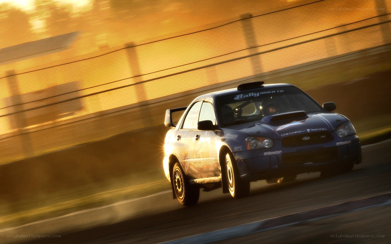 Blue rally car in motion