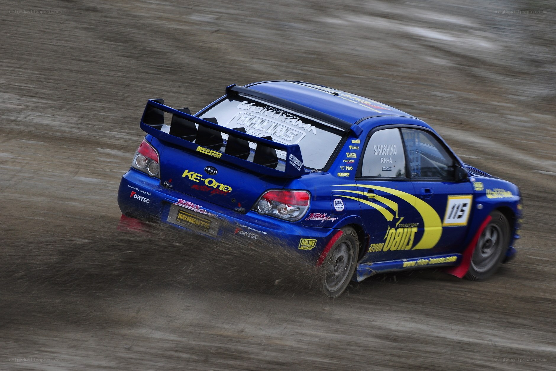 blue rally car in motion