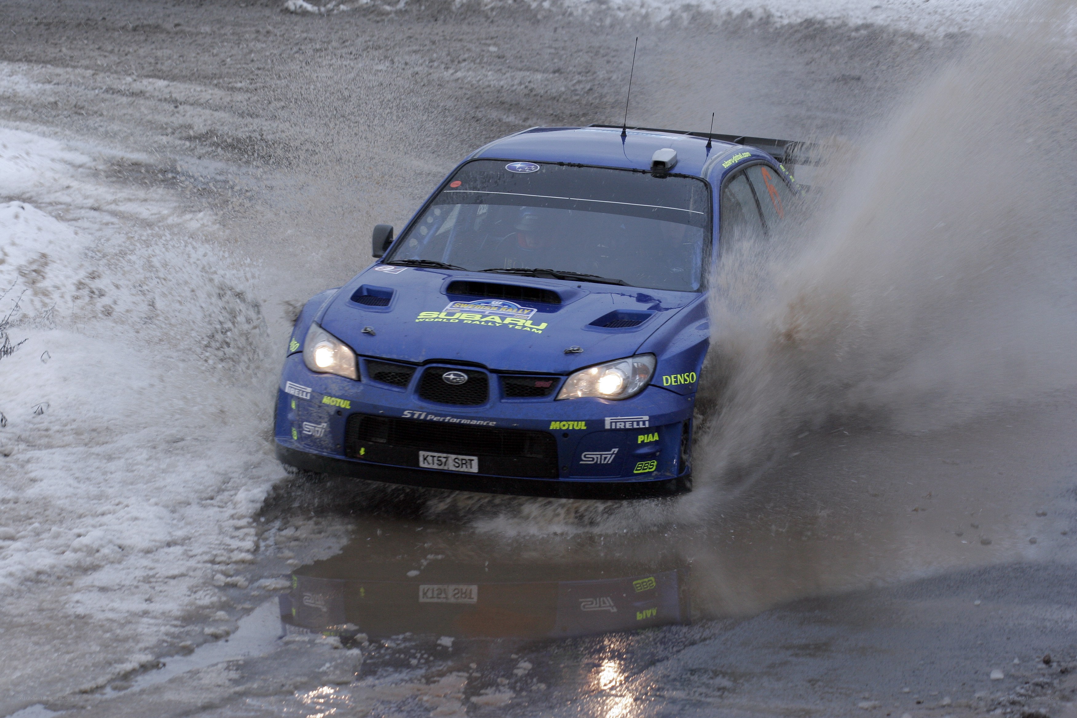 Blue rally car in snow