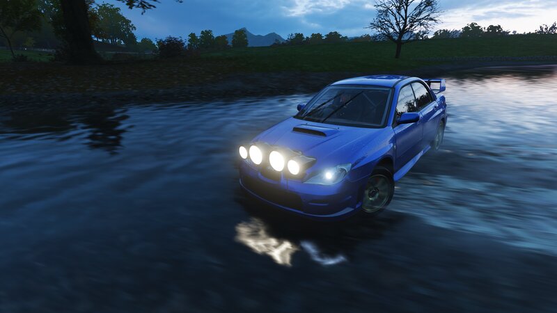 Blue Rally Car in Water — Dramatic
