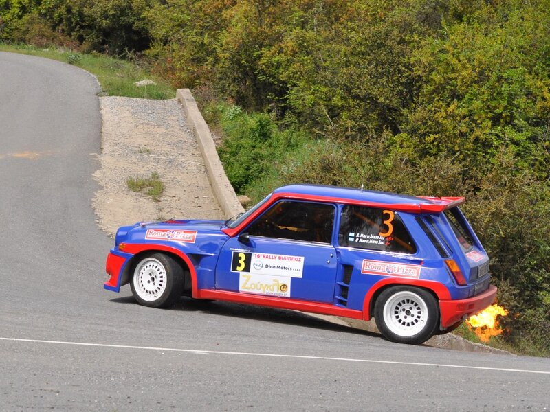 Blue rally car on a winding road
