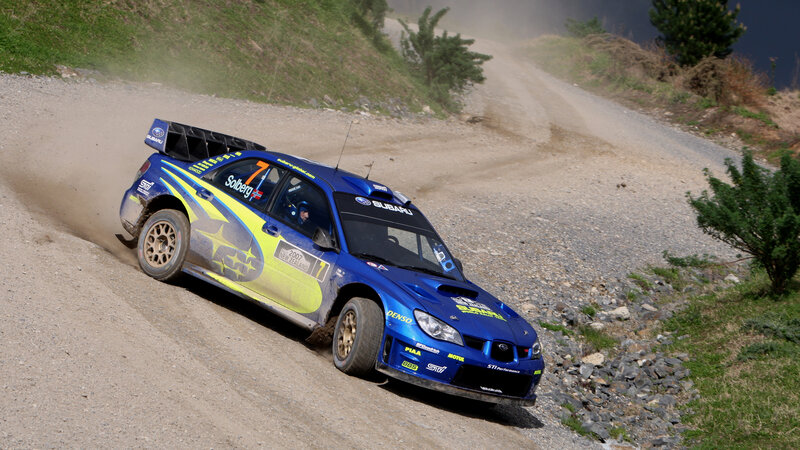Blue Rally Car on Dirt — Dynamic, Afternoon, Photograph, Dirt Road