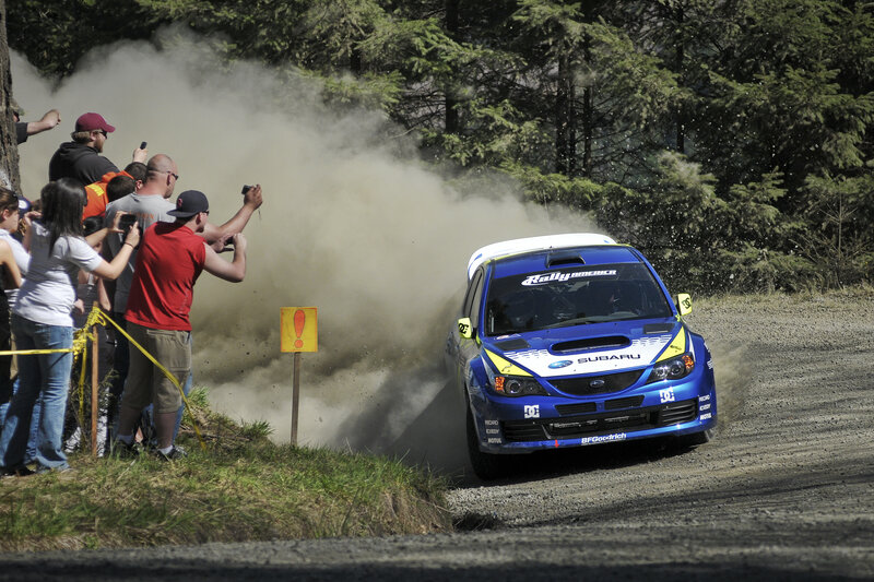 Blue rally car on dirt road