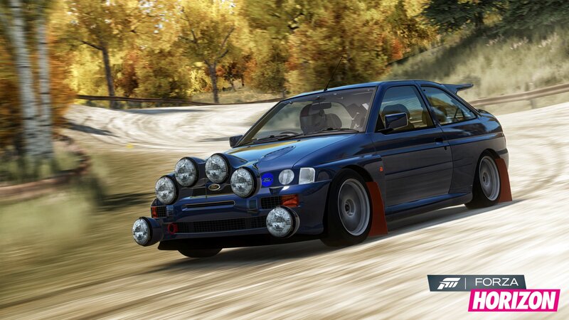 blue rally car on dirt road