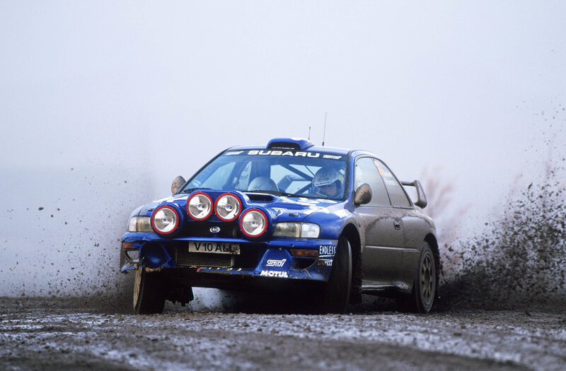 Blue rally car on dirt track