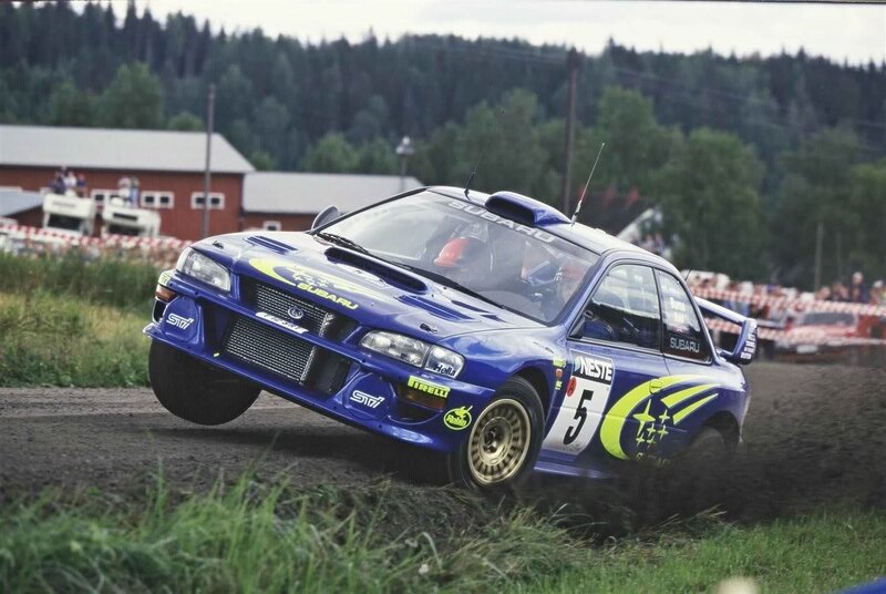 Blue rally car on dirt track