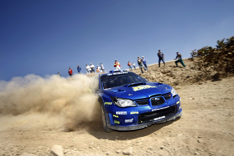 Blue rally car on dirt track