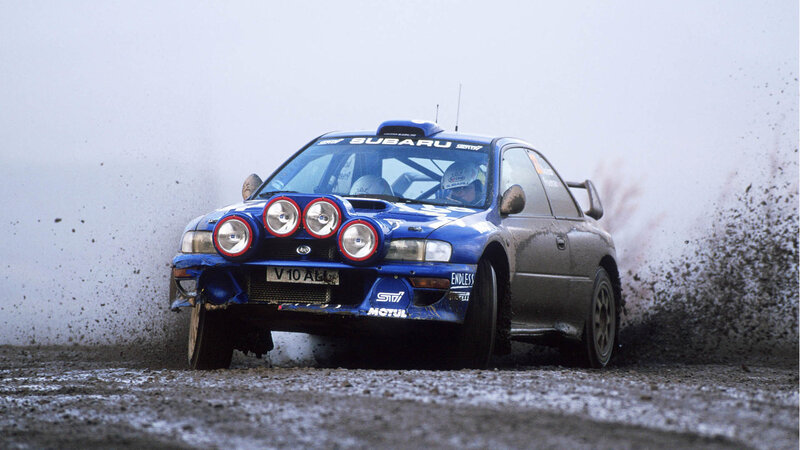 Blue rally car on dirt track