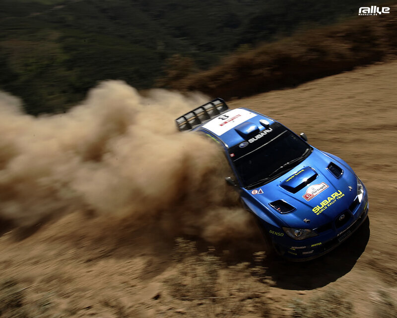 Blue rally car on dirt track