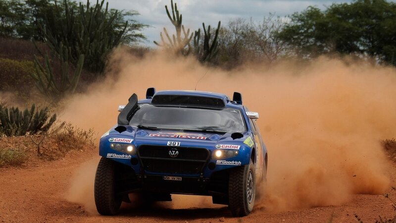 Blue rally car on dirt track