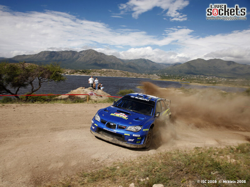 Blue rally car on dirt track
