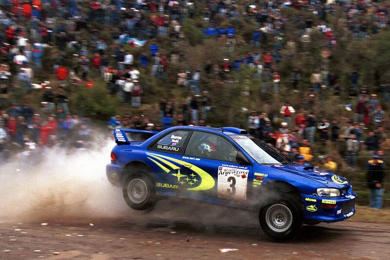 Blue rally car on dirt track