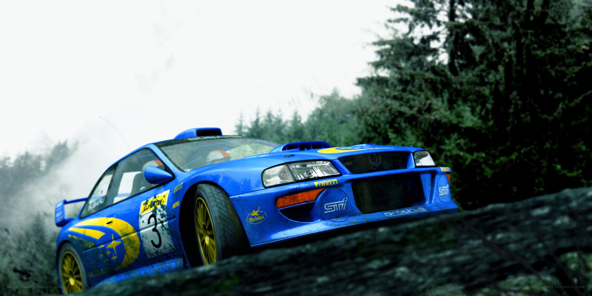 blue rally car on forest road