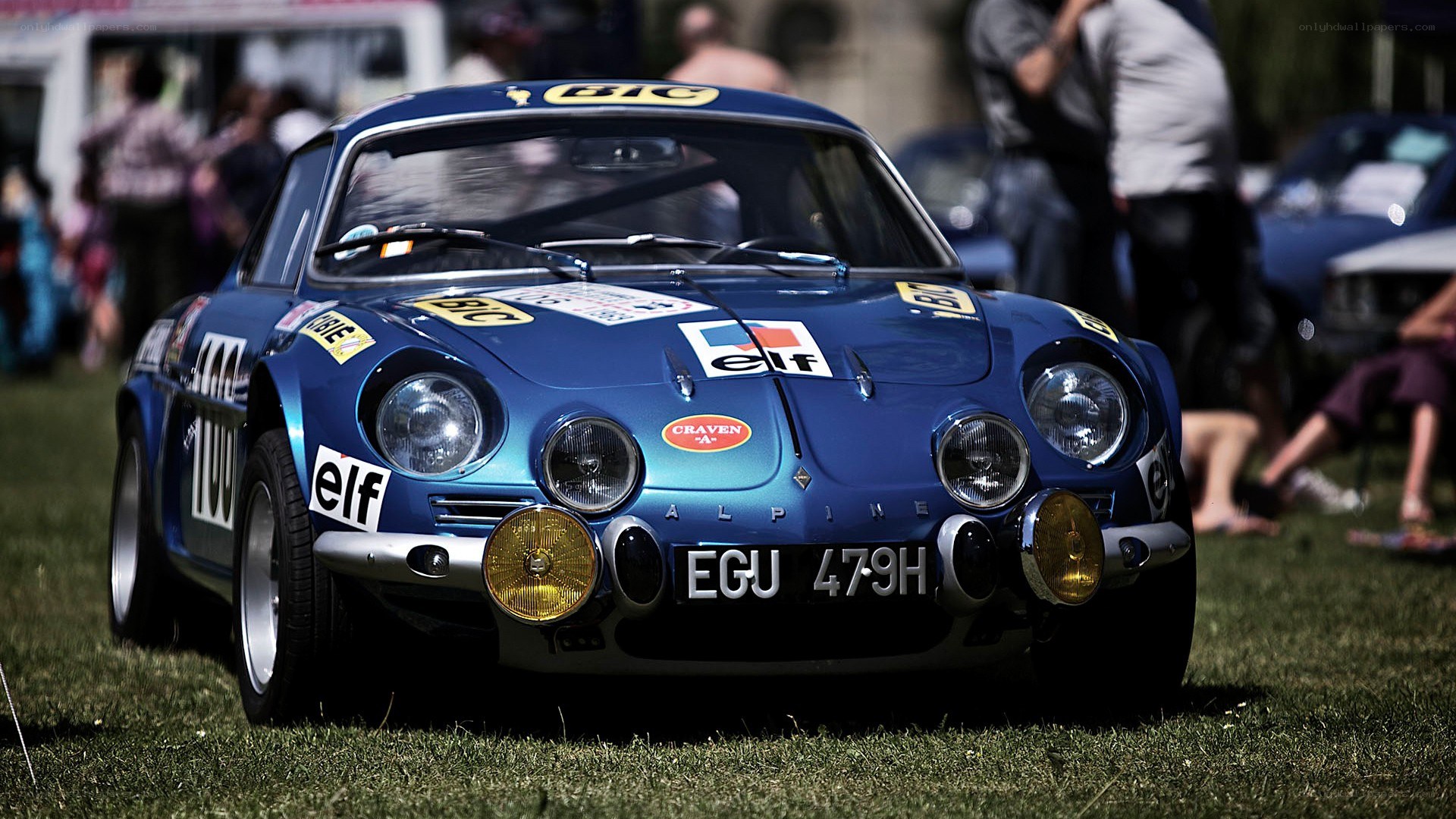 Blue rally car on grass
