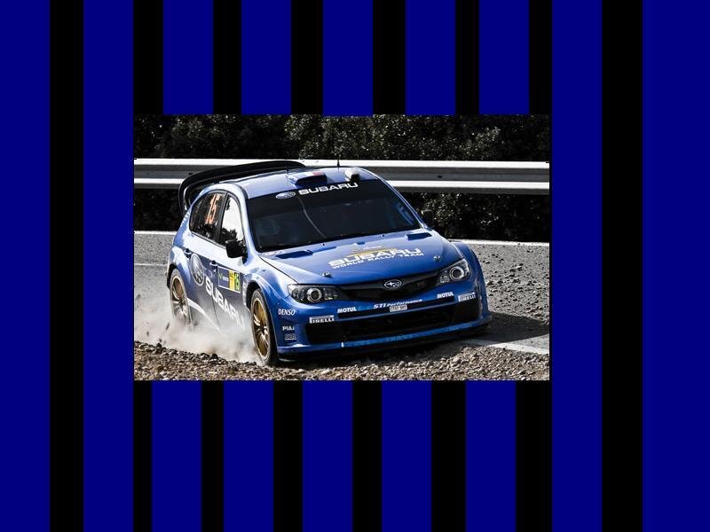 Blue rally car on gravel