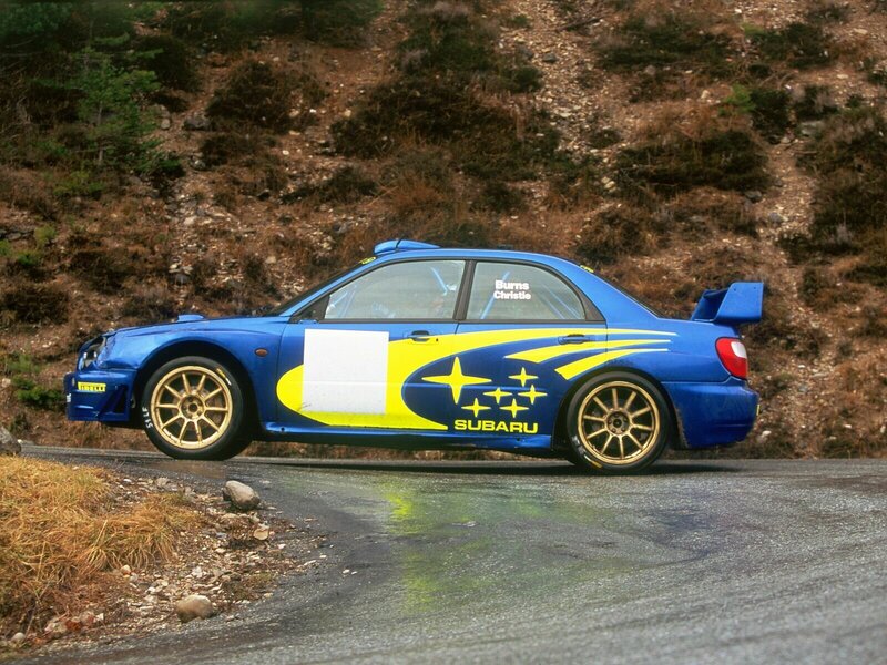 blue rally car on road