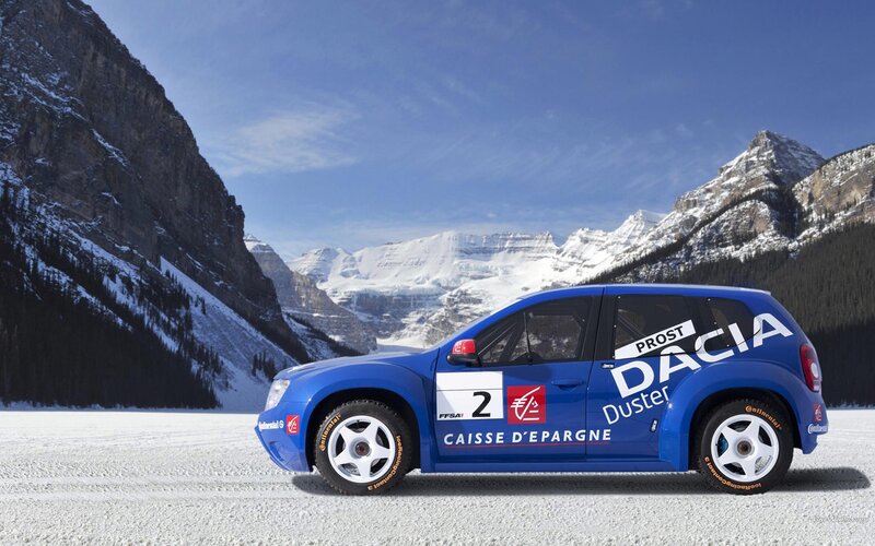 Blue rally car on snowy mountain