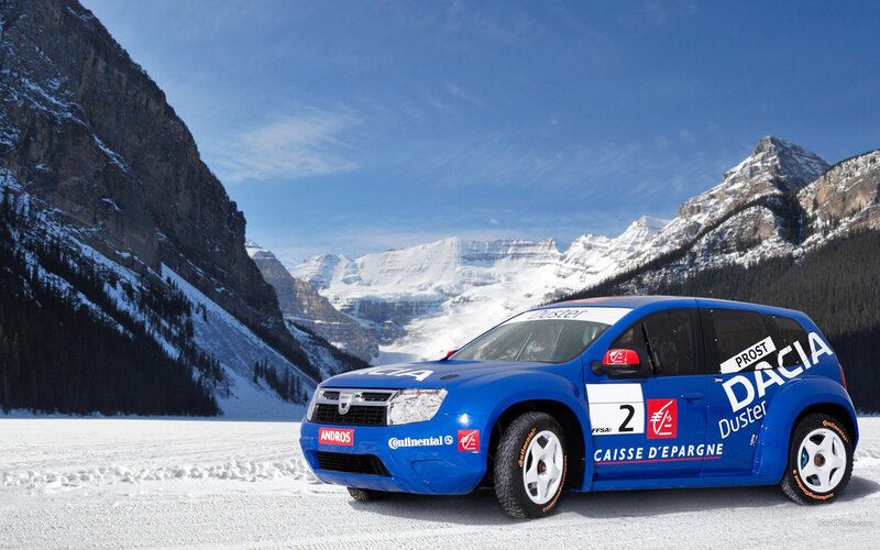 Blue rally car on snowy mountain