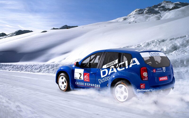 Blue rally car on snowy mountain
