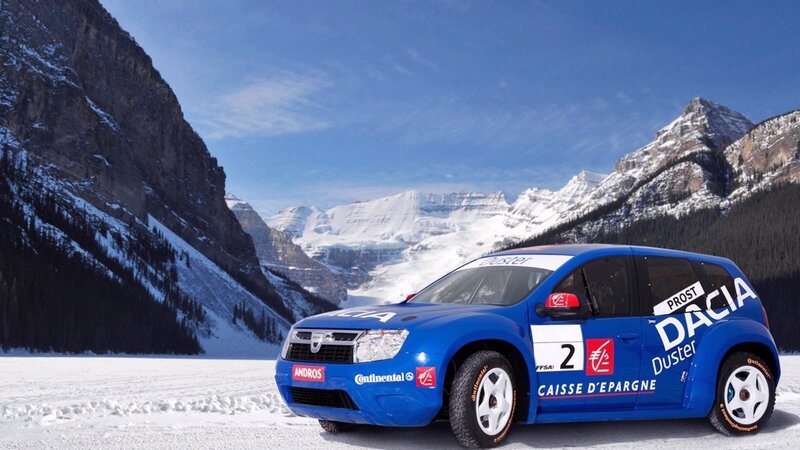 Blue rally car on snowy mountain