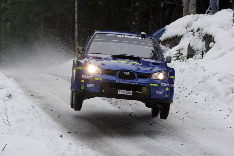 Blue rally car on snowy road