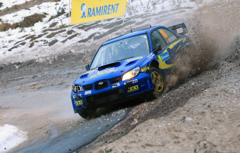 Blue rally car on snowy track