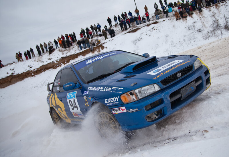 Blue rally car on snowy track
