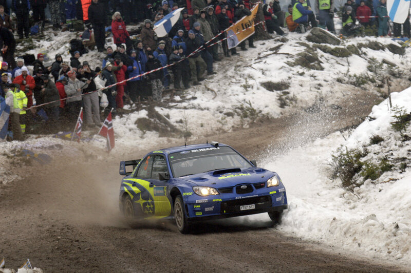Blue rally car on snowy track