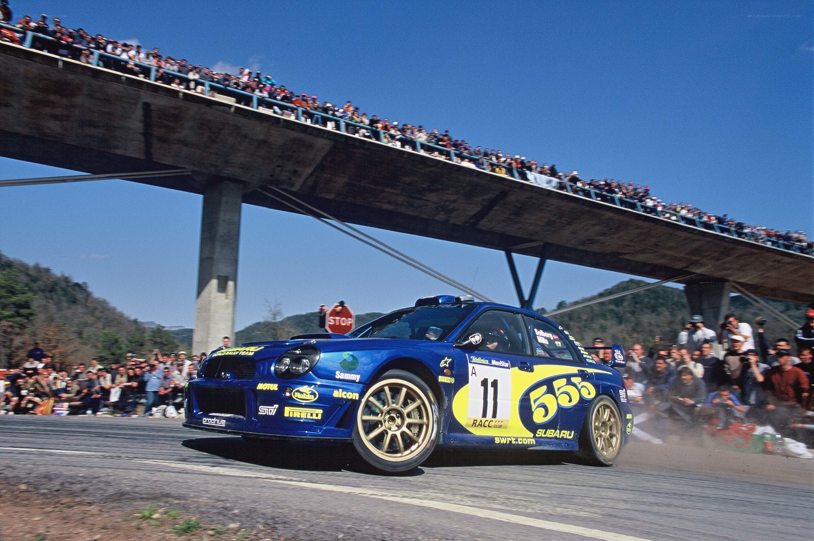 Blue rally car on track