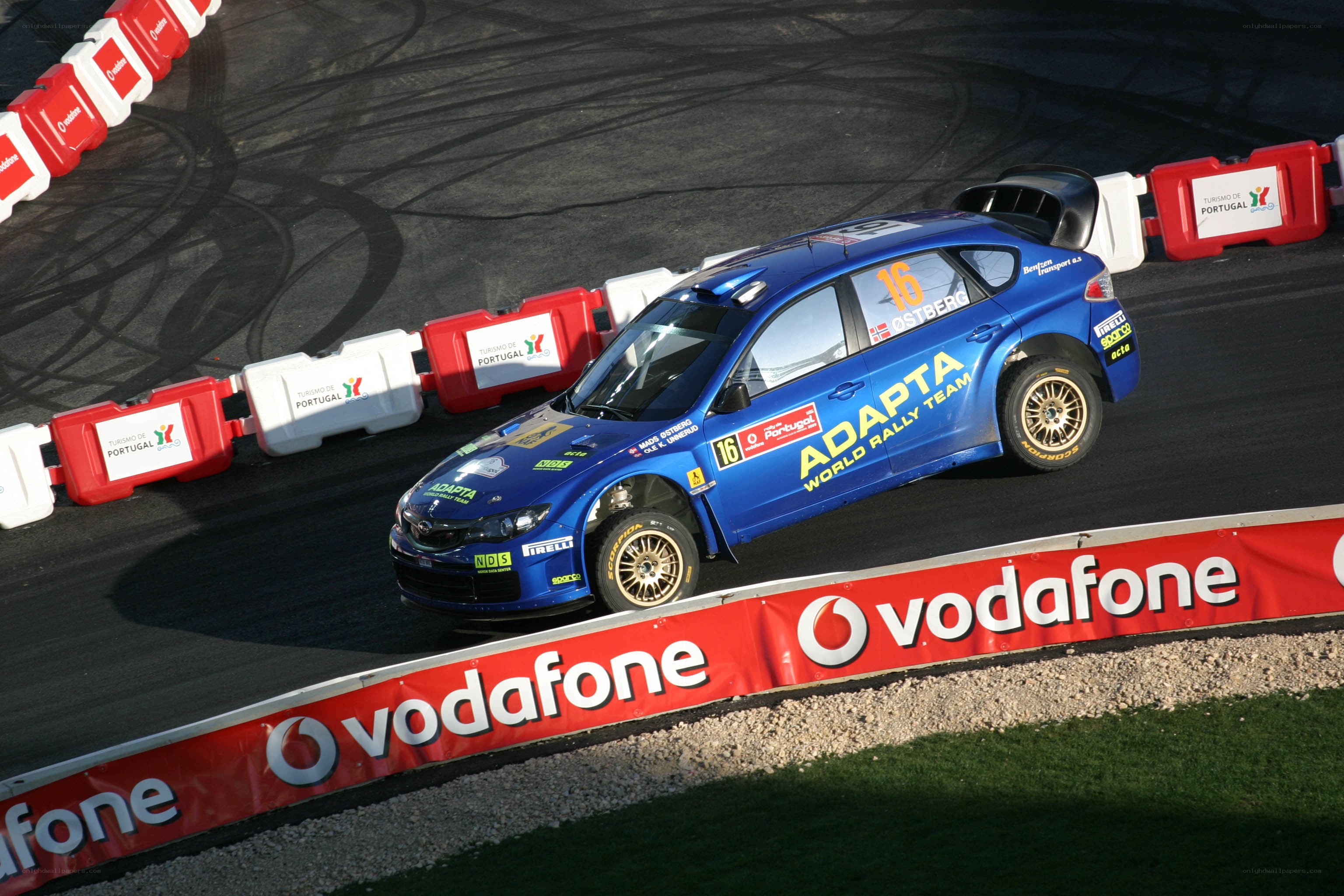 Blue rally car on track