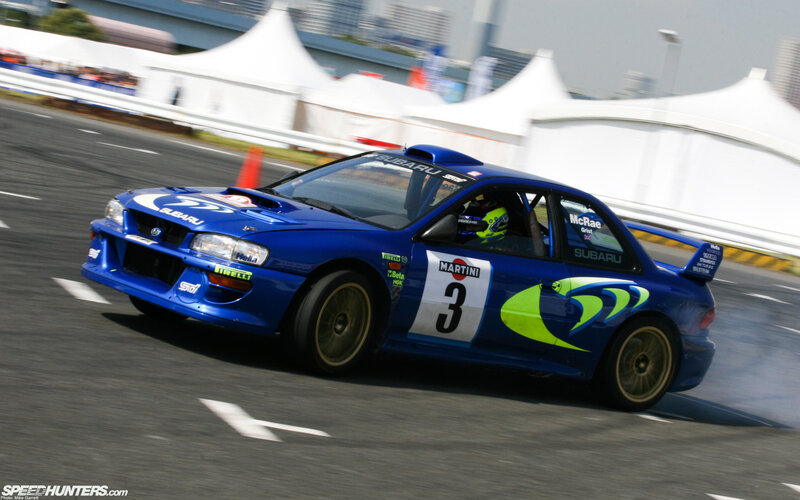 blue rally car on track