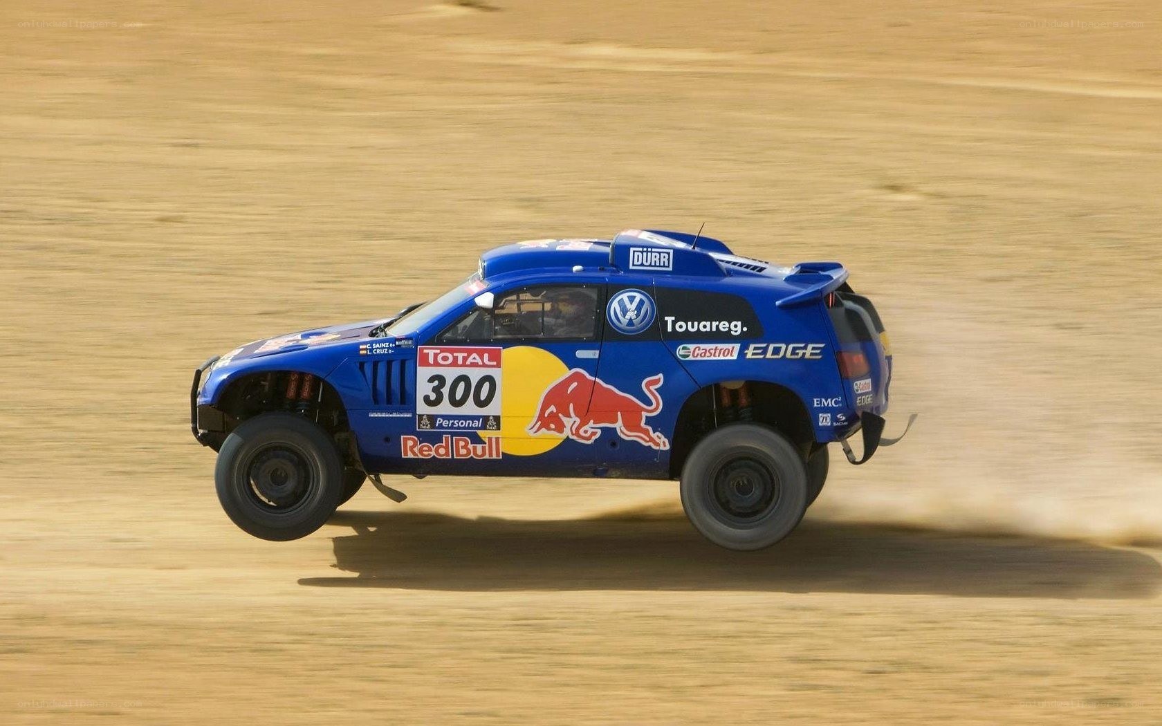 Blue rally car racing