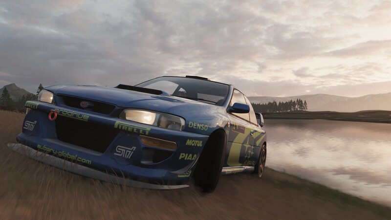 Blue Rally Car — Serene, Sunset