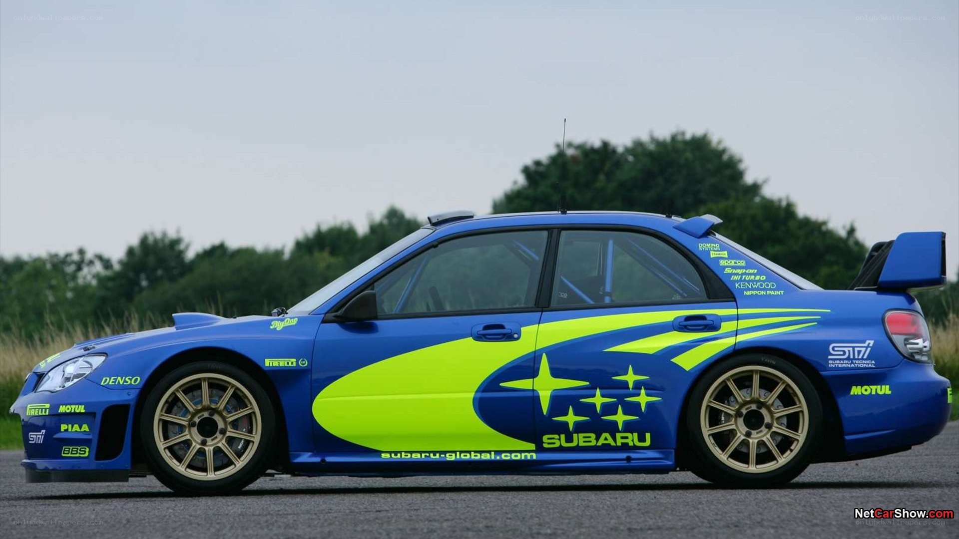 blue rally car side view