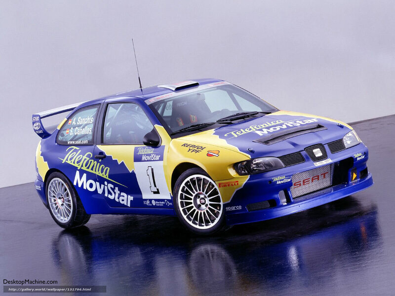 blue rally car with sponsor logos