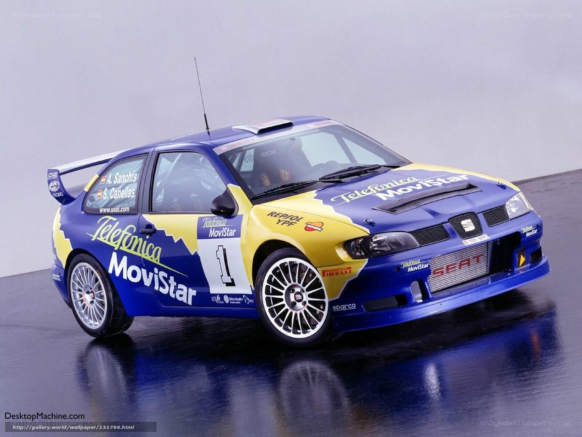 blue rally car with sponsor logos